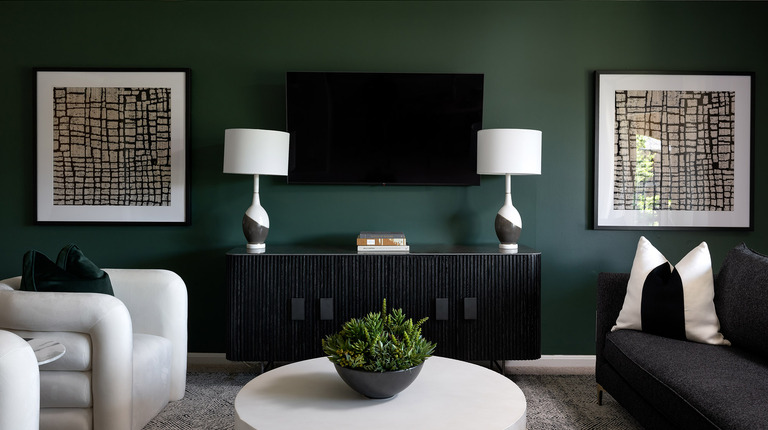Living room with crown molding and natural light