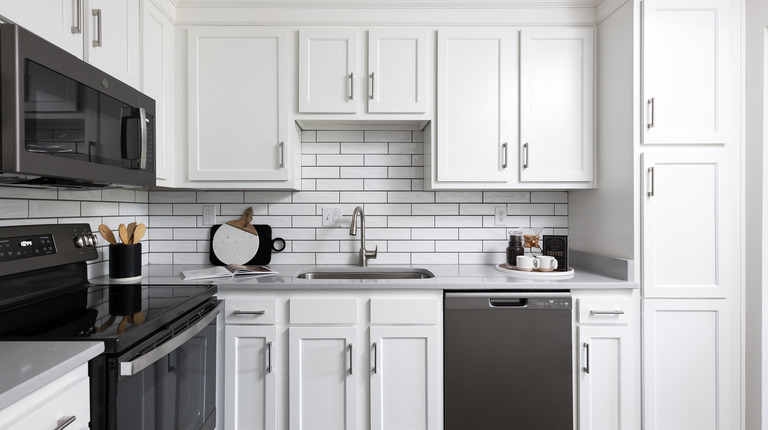 Gourmet kitchen with slate appliance and custom cabinetry