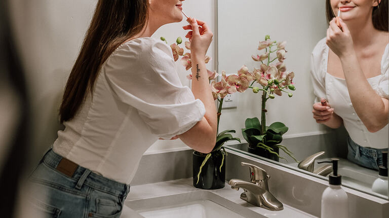 Modern bathroom vanity with bright lighting 