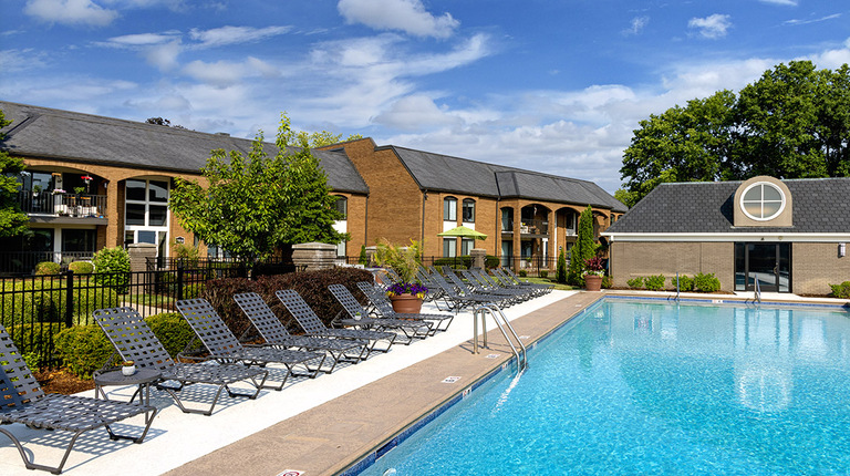 Resort-inspired pool with sundeck and lounge seating